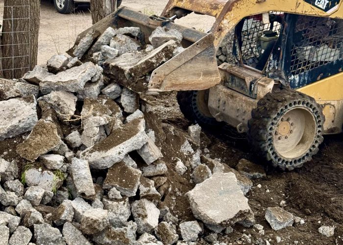 Skid Steer Service in Billings. Dirt & gravel spreading, driveway repair & maintenance, land clearing & site preparation, brush & vegetation removal, grading & leveling, backfilling & excavation support, trenching assistance, small demolition projects (sheds, concrete pads, etc.), post hole digging (for fencing, signposts, etc.), material hauling & placement (rock, soil, mulch).