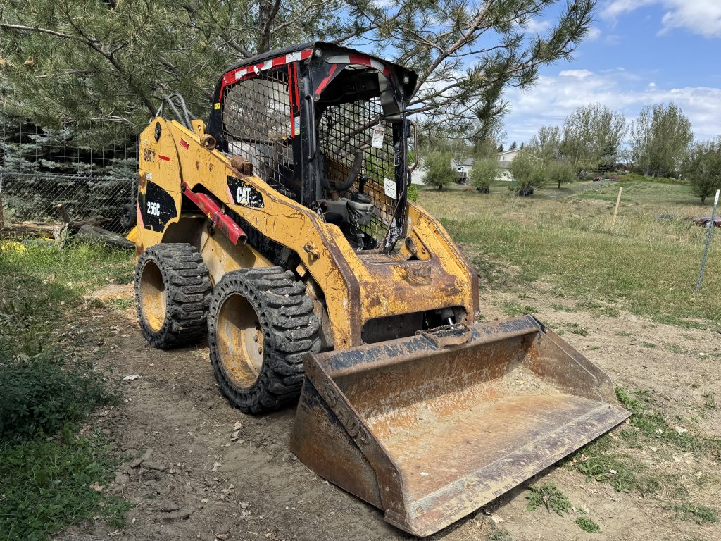 Skid Steer Service in Billings. Dirt & gravel spreading, driveway repair & maintenance, land clearing & site preparation, brush & vegetation removal, grading & leveling, backfilling & excavation support, trenching assistance, small demolition projects (sheds, concrete pads, etc.), post hole digging (for fencing, signposts, etc.), material hauling & placement (rock, soil, mulch).